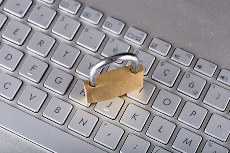 Padlock on computer keyboardの写真素材