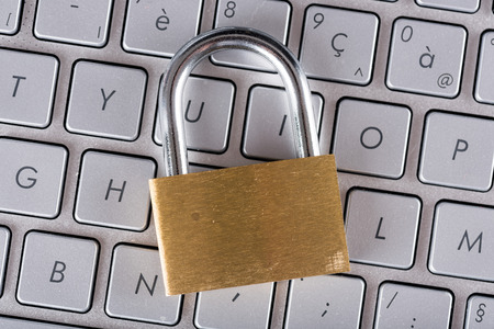 Padlock on computer keyboardの写真素材