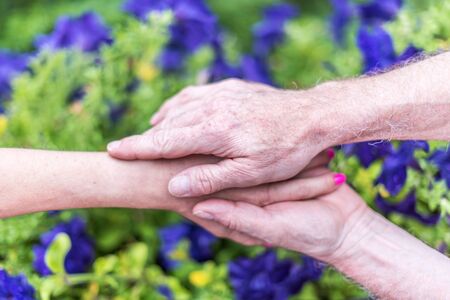 Woman and man holding hands with loveの写真素材