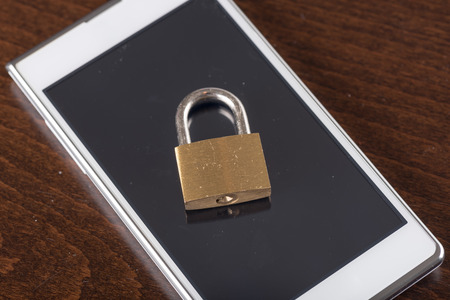 Padlock on a smartphone, security conceptの写真素材