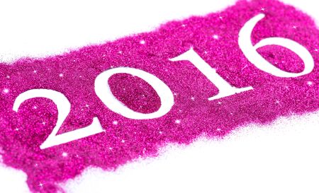 Happy new year 2016 written with pink glittersの写真素材