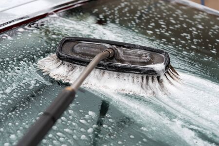 Car washing with a brush