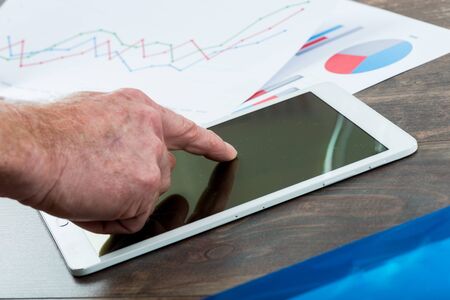 Finger touching tablet computer
