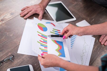Team discussing about financial charts