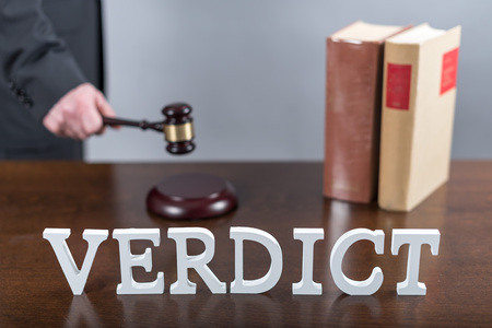 Verdict concept with a lawyer in backgroundの写真素材