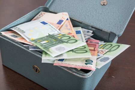 Box full of euro banknotes