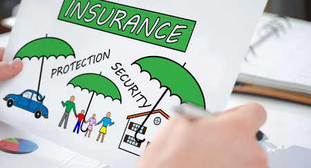 Hands holding a paper showing a insurance conceptの写真素材