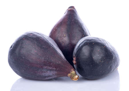 Ripe purple figs, isolated on white