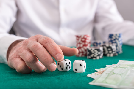 Player playing with dicesの写真素材