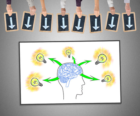 Hands holding writing slates with arrows pointing on human brain ideas concept