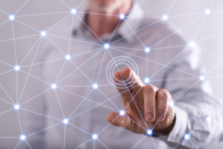 Man touching a virtual network on a touch screen with his finger
