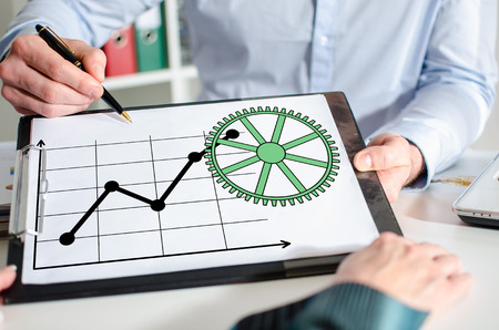 Businessman showing business analysis concept on a clipboard