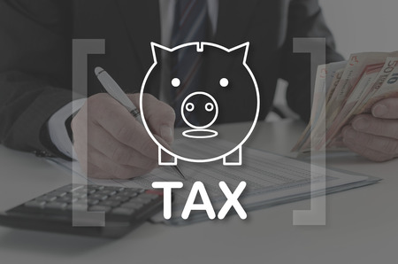 Tax concept illustrated by a picture on backgroundの写真素材