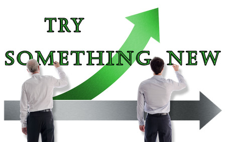 Try something new concept drawn on a white wall by businessmenの写真素材