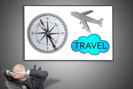 Relaxed businessman looking at travel concept on a whiteboardの写真素材