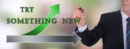 Businessman drawing a try something new concept