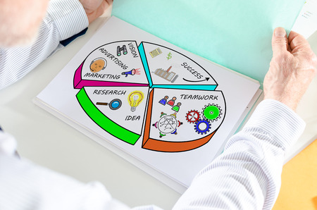 Man holding a file with business strategy concept