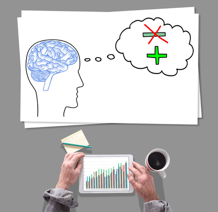 Male hands using tablet in front of positive thought conceptの写真素材