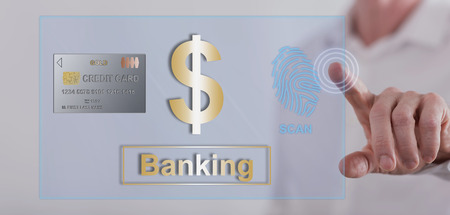 Man touching a banking security concept on a touch screen with his fingerの写真素材