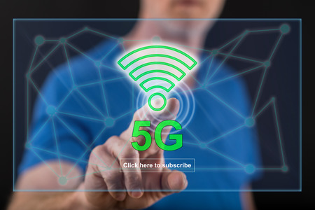 Man touching a 5g concept on a touch screen with his finger