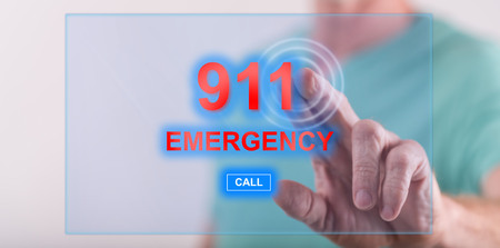 Man touching an emergency concept on a touch screen with his finger