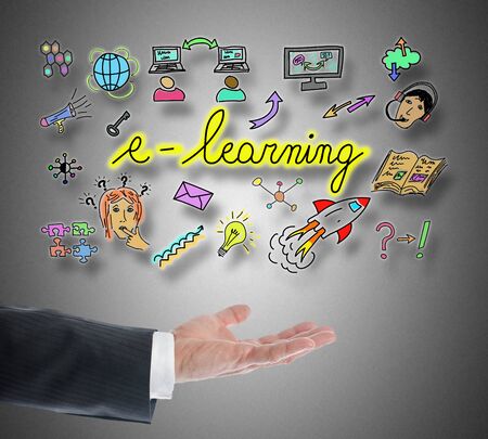 E-learning concept levitating above a hand on grey backgroundの写真素材