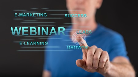 Man touching a webinar concept on a touch screen with his fingerの写真素材