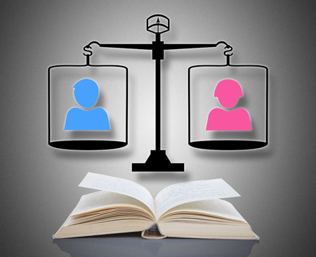 Equality concept above an open bookの写真素材