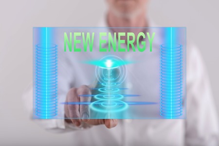 Man touching a new energy concept on a touch screen with his fingerの写真素材