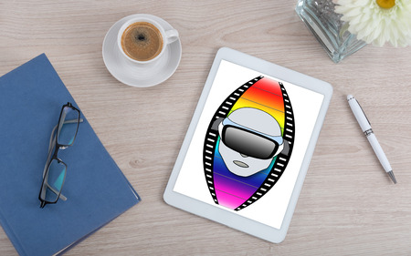 Top view of a desk with virtual reality concept on a digital tabletの写真素材