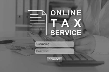 Online tax service concept illustrated by a picture on backgroundの写真素材