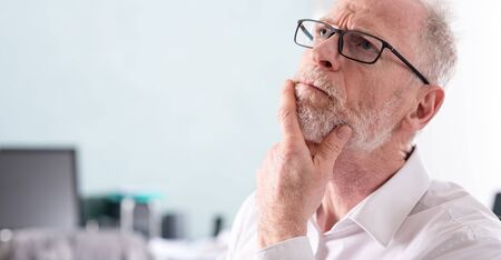 Portrait of thoughtful senior businessmanの写真素材