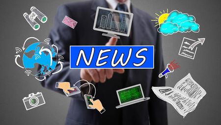 News concept shown by a businessman in backgroundの写真素材