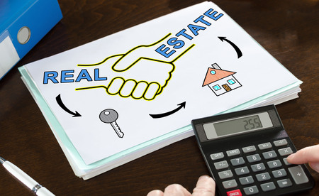 Real estate concept illustrated on a paper with a calculatorの写真素材