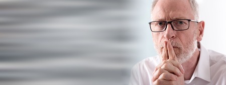 Portrait of thoughtful senior businessman with glassesの写真素材