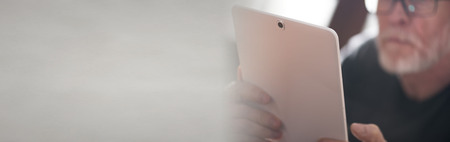 Senior man using a tabletの写真素材