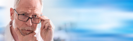 Portrait of thoughtful senior man with glassesの写真素材