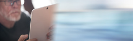 Senior man using a tabletの写真素材