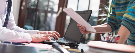 Manager working with executive assistant in office