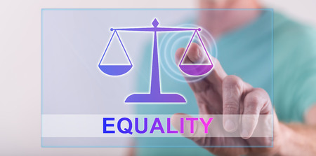 Man touching an equality concept on a touch screen with his fingerの写真素材