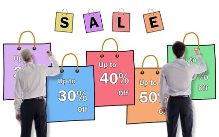 Sale concept drawn on a white wall by businessmenの写真素材