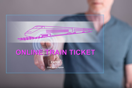 Man touching an online train ticket concept on a touch screen with his fingerの写真素材