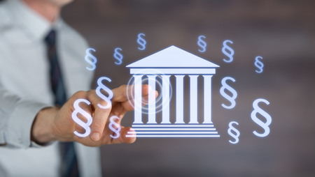 Man touching a law concept on a touch screen with his fingerの写真素材