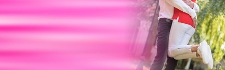 Couple hugging with love on blurred backgroundの写真素材