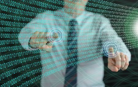 Man touching a digital technology concept on a touch screen with his fingerの写真素材