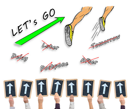 Hands holding writing slates with arrows pointing on action conceptの写真素材