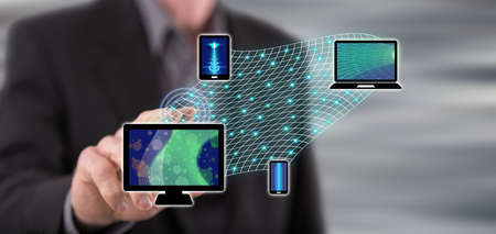 Man touching a device connection concept on a touch screen with his finger