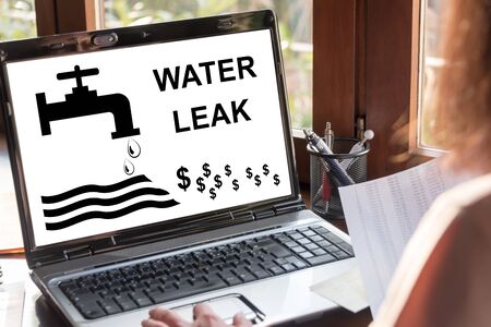 Laptop screen showing water leak conceptの写真素材