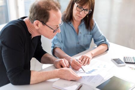 Coworkers having a business discussion in officeの写真素材
