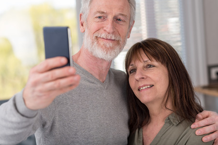 Happy mature couple taking a selfie